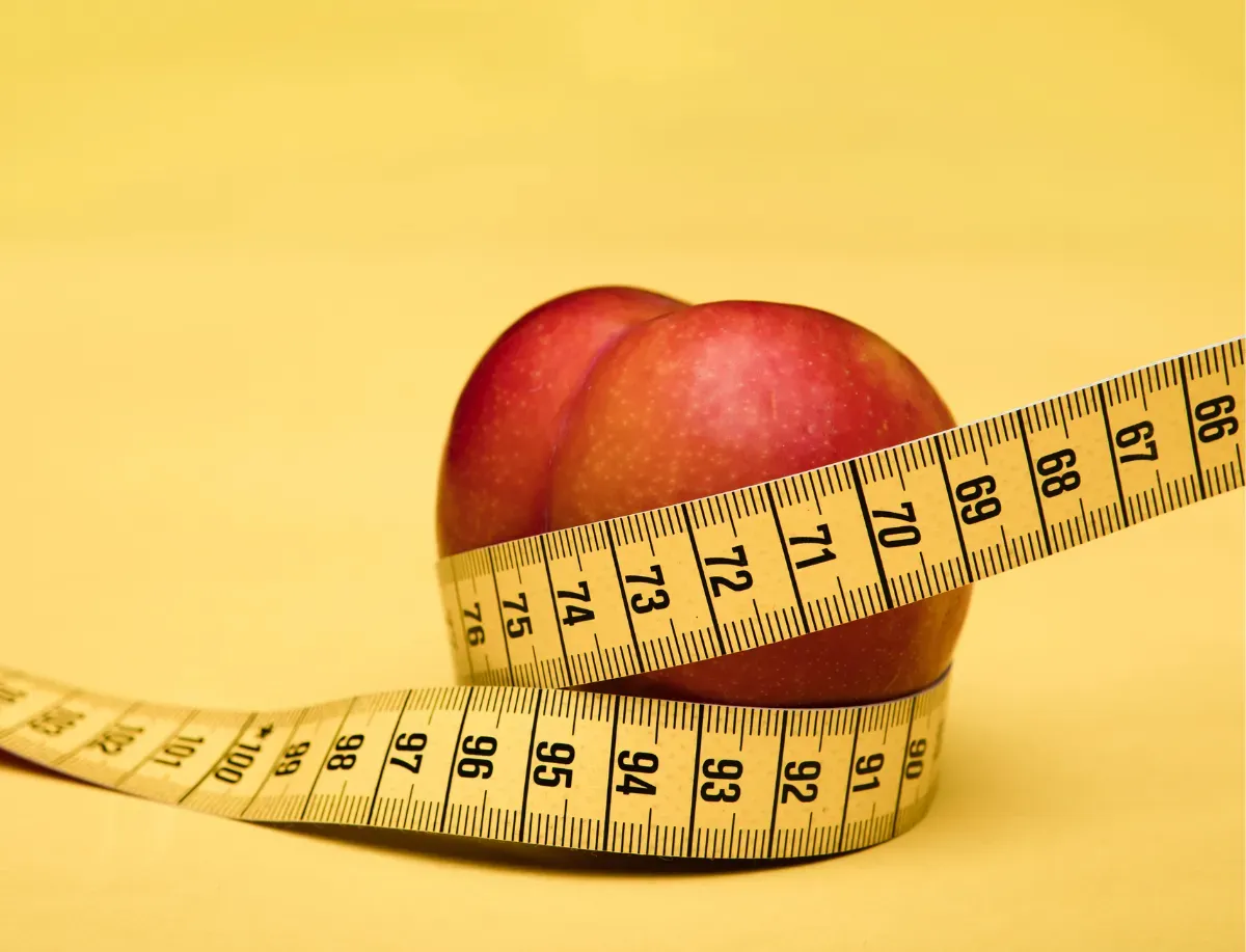 Apple with measuring tape