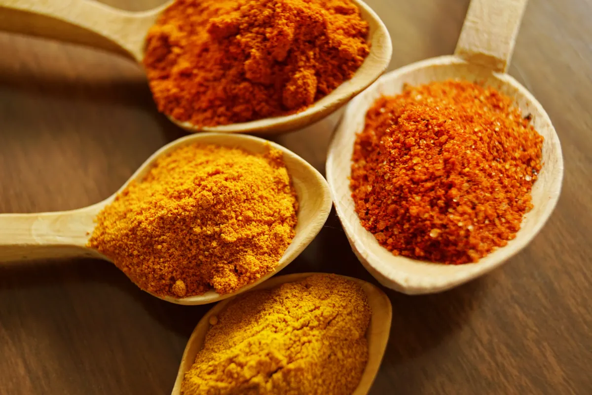 turmeric powders on spoon